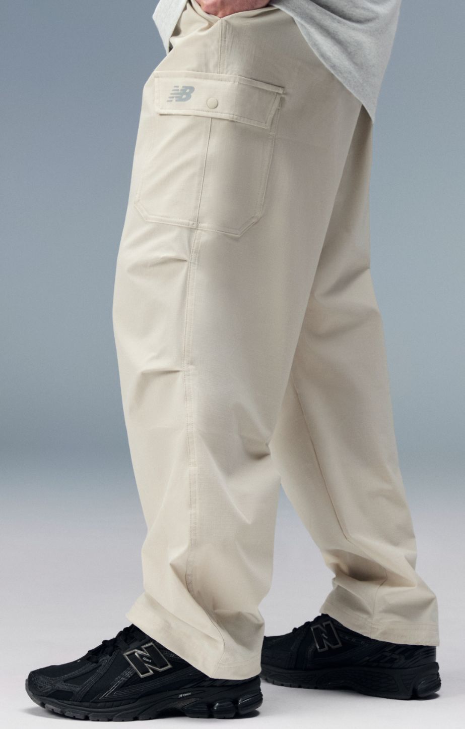 Person standing and wearing new balance 1906 sneakers